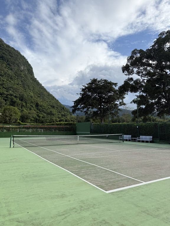 Che Elpend court with courtside benches and floodlights